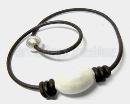 Leather neckless and white ceramics